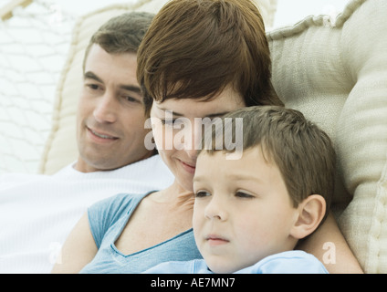 Family relaxing in hammock together, close-up Stock Photo