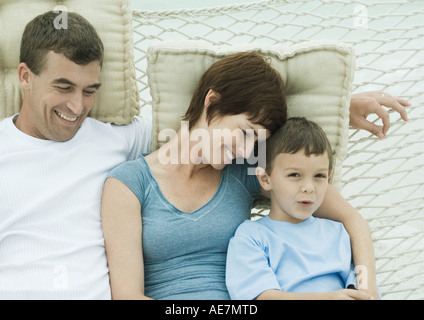 Family relaxing in hammock Stock Photo