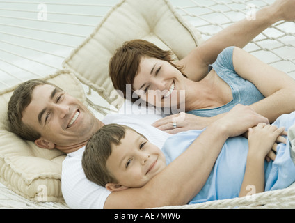 Family relaxing in hammock Stock Photo