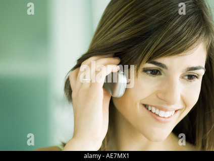 Young woman using cell phone Stock Photo