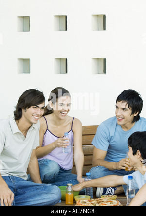 Group of young adult friends sharing meal Stock Photo