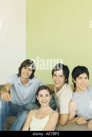 Four young adult friends smiling Stock Photo