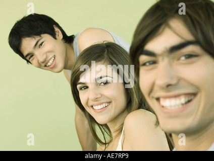 Three young adult friends smiling Stock Photo