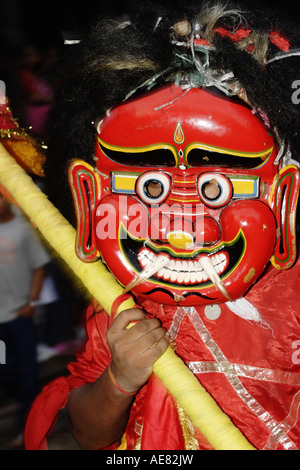 The Ghost or Devil parading around the streets of Kathmandu in the Gai Jatra festival Nepal Stock Photo