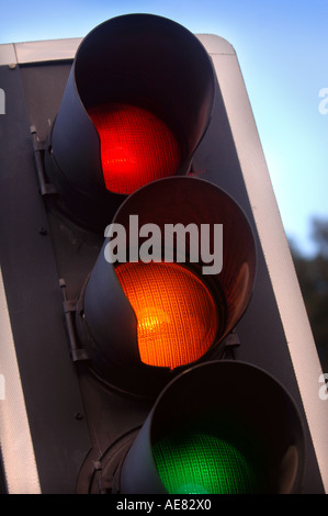 TRAFFIC LIGHTS SHOWING AMBER GREEN AND RED AT A CROSSROADS IN THE UK Stock Photo