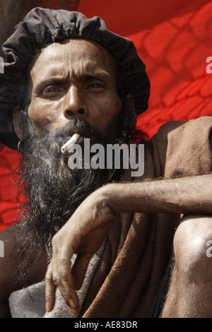 Rasta style Hindi holy man is smoking a joint at the Mahashivratri festival in Nepal 2007 Stock Photo