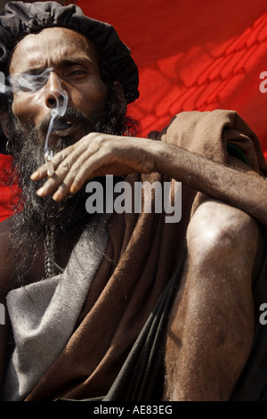 Rasta style Hindi holy man is smoking a joint at the Mahashivratri festival in Nepal 2007 Stock Photo