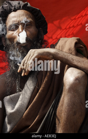 Rasta style Hindi holy man is smoking a joint at the Mahashivratri festival in Nepal 2007 Stock Photo