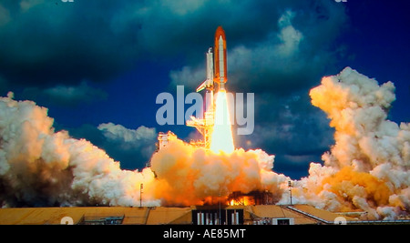 NASA shuttle lifting off from Cape Canaveral, Florida on exploratory mission into outer space Stock Photo