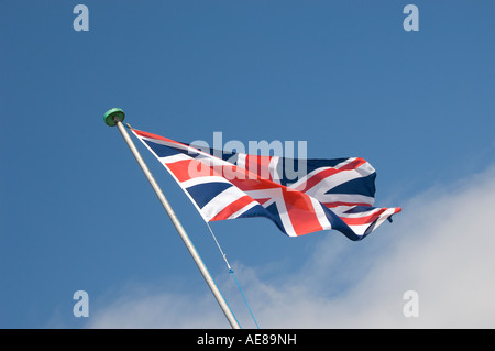 Union Jack flag against blue sky England UK United Kingdom GB Great Britain Stock Photo