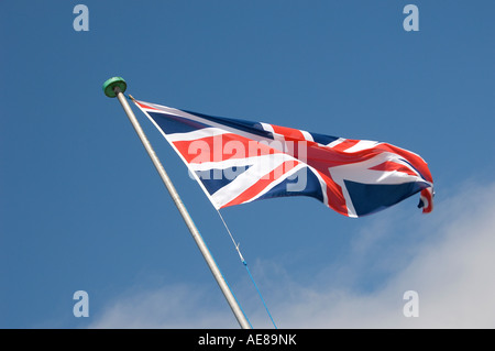 Union Jack flag against blue sky England UK United Kingdom GB Great Britain Stock Photo