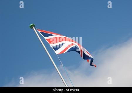 Union Jack flag against blue sky England UK United Kingdom GB Great Britain Stock Photo