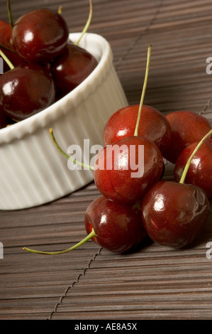 Close up of red cherries in bowl Stock Photo