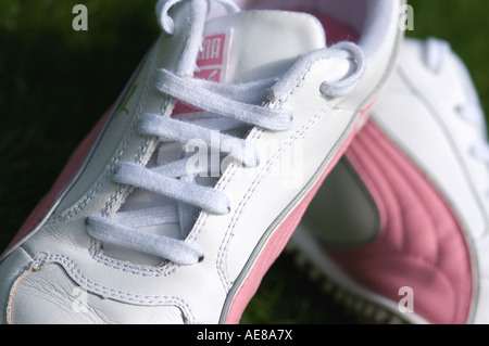 Close up of womens white and pink trainers Stock Photo