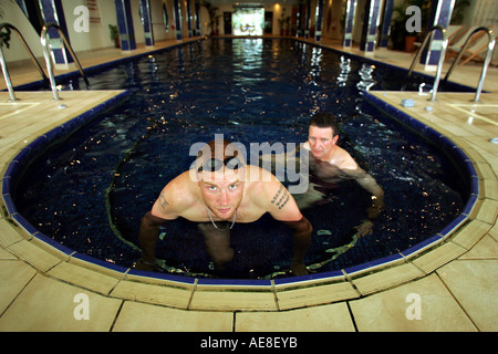 England cricketer Andrew Freddy Flintoff training at the Bovey Castle Hotel on Dartmoor with trainer Dave Rooster Roberts Stock Photo