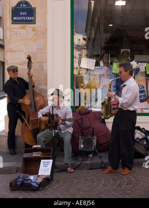Jazz trio of street musicians play music on corner of Rue Mouffetard 5th Arrondissement left bank Paris France Stock Photo