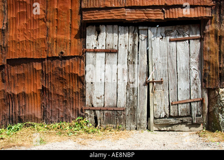 Image of Rusty Tin Sheet and Old Wooden Door Stock Photo