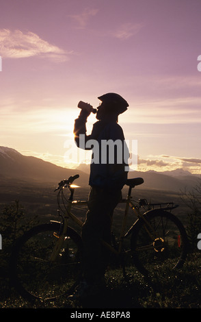 Mountain biker silhouette Smithers British Columbia Stock Photo