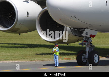 A380 Airbus A380 new large double decker airliner due to enter passenger service 2006 with ground engineer Stock Photo