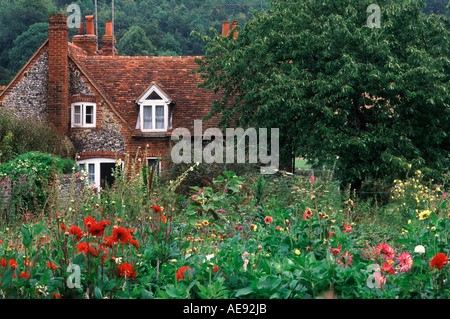 Pretty flint and terracotta tiled cottage and classic English flower garden in village of Hambleden, Buckinghamshire, England Stock Photo
