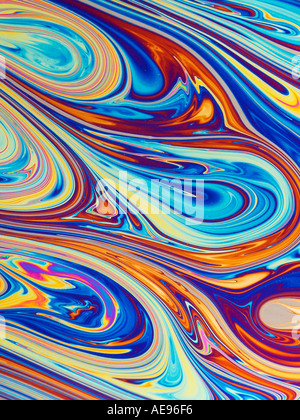 Closeup of psychedelic multicolored reflections on the surface of a soap bubble. Stock Photo