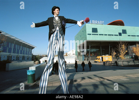 Man on high pole in Peckham south London Stock Photo