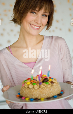Portrait of family with a birthday cake Stock Photo - Alamy