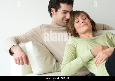 Couple lying on a sofa Stock Photo