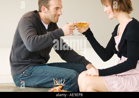 Smiling couple clinking glasses of champagne Stock Photo