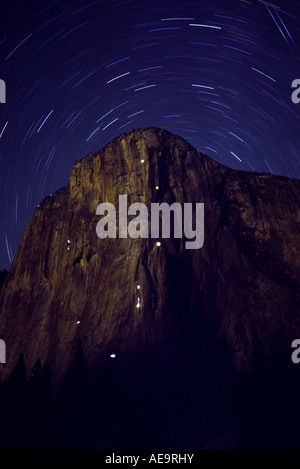 Rock Climbers on El Capitan at night with star trails and moonlight. Yosemite National Park, California Stock Photo