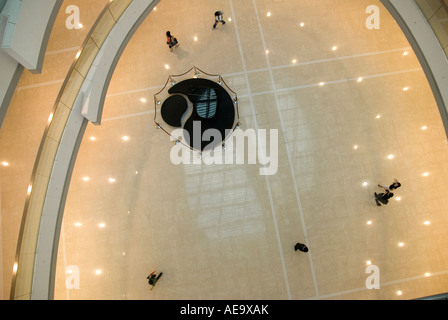 People Shopping and Enjoying inside IFC in Hong Kong Stock Photo