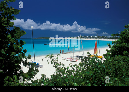 Maunday s Bay Anguilla at Cap Juluca resort hotel peering through the sea grapes out to the sugar white sand and sailing Stock Photo