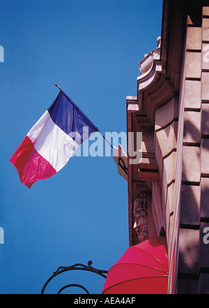 French flag flying outside building Paris France EU Europe Stock Photo