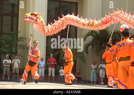 Professional dancers running and doing a Dragon Dance for the Chinese New Year celebration. Stock Photo
