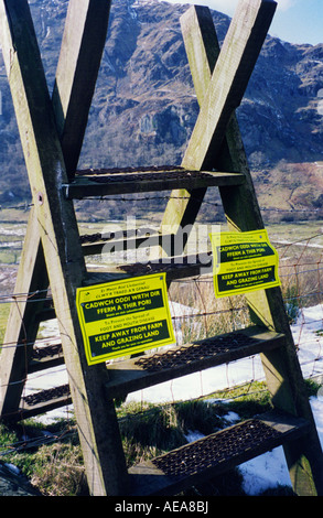 Stile with a Foot and Mouth sign in Snowdonia national park area Stock Photo