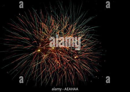 fireworks exploding in night sky fireworks pyrotechnics display festival entertainment guy guido fawkes spectacular lights amuse Stock Photo