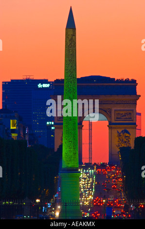 Paris view of Obelisk Champs Elysees and Arc de Triomphe from Tuileries Gardens at Sunset Stock Photo