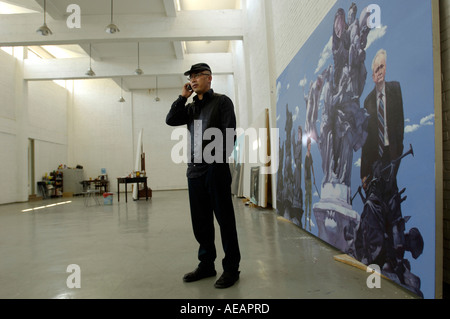 Yang Shaobin, chinese contemporary artist, poses in front of his work named 'DNA' in his studio in Songzhuang of Beijing, China. Stock Photo