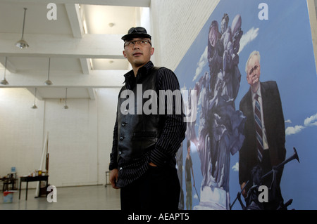 Yang Shaobin, chinese contemporary artist, poses in front of his work named 'DNA' in his studio in Songzhuang of Beijing, China. Stock Photo