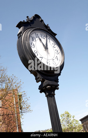 Black Outdoor commuter Clock and sky Stock Photo