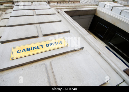 Brass name plaque and entrance to the Cabinet Office in Whitehall Central London UK Stock Photo