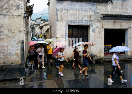 Chinese Tour Group in the Rain Ancient Huizhou Style Chinese Village Xidi China Stock Photo