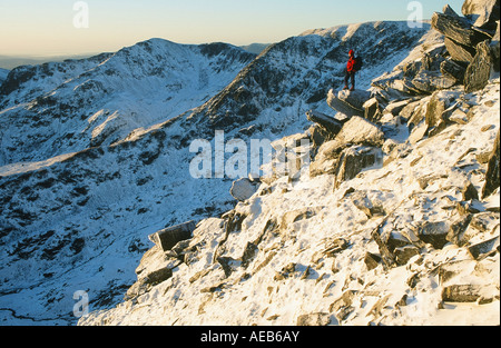 A mountaineer on Striding Edge, Helvellyn at dawn, Lake District, UK Stock Photo