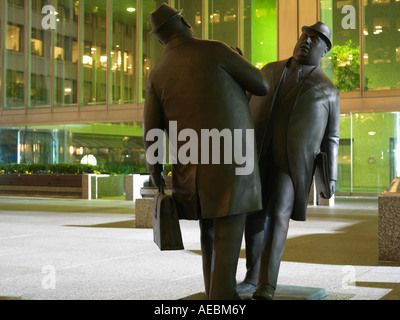 Canada Ontario Toronto bronze sculpture by William McElcheran Encounter two business men bumping into each other Stock Photo