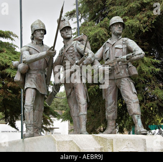 A war memorial in Mafra, Portugal, showing the uniforms of 3 military periods: medieval, peninsular (19c) and modern Stock Photo