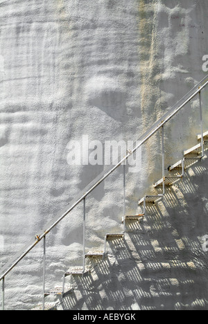 Metal Stairs On Old Rusty Bumpy White Stucco Curved Wall, USA Stock Photo