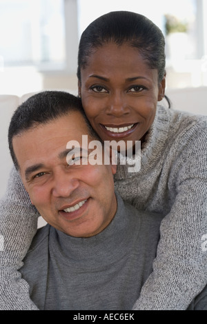 Middle-aged African hugging Stock Photo