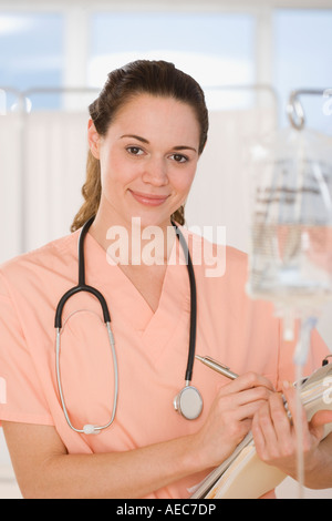 Hispanic female doctor holding chart Stock Photo