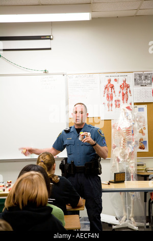 Police officer Mercier is giving a presentation on narcotics to a ...