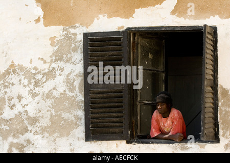 African man looking out from window Ghana Africa Stock Photo